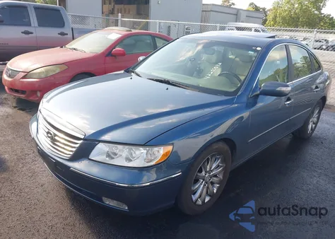 2009 Hyundai Azera Limited z USA, uszkodzony, nr VIN KMHFC46FX9A343602